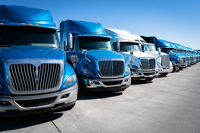 A fleet of trucks. Achieve optimal engine performance while minimizing harmful emissions with Valley Distribution's Diesel Exhaust Fluid (DEF).